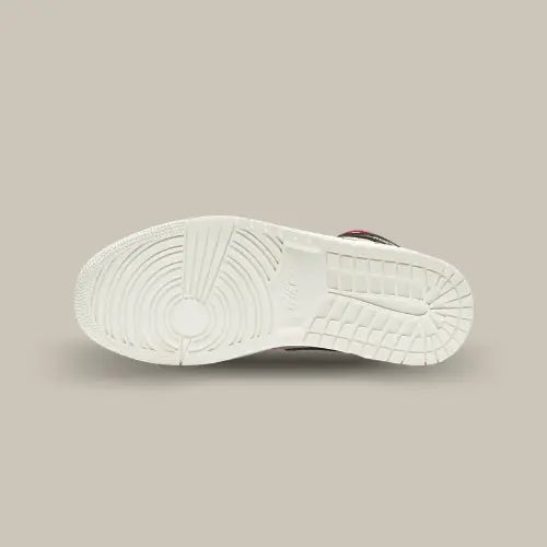 La semelle de la Air Jordan 1 Mid Canyon Rust de couleur blanche.