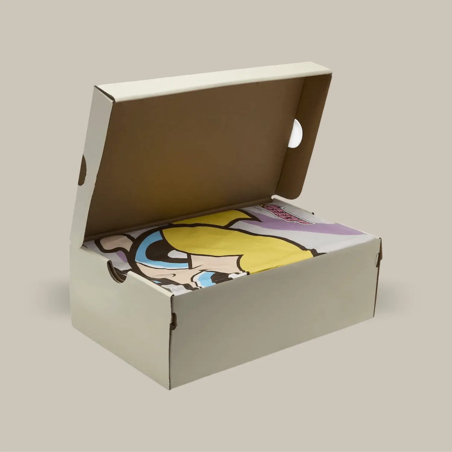 La boîte de la Nike SB Dunk Low The powerpuff Bubbles avec le papier représentant Bubbles (Bulle).