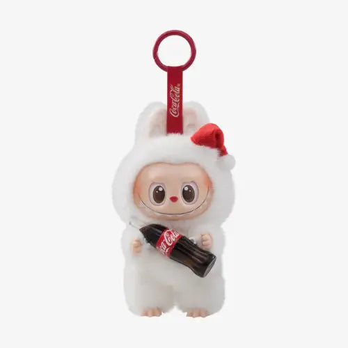 Figurine Pop Mart Labubu Coca-Cola – modèle Surprise Shake en costume blanc avec bonnet rouge, tenant une bouteille en vinyle, édition The Monsters.