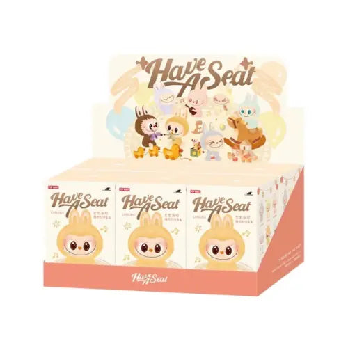 Présentoir Pop Mart Labubu Have a Seat – coffret blind box scellé avec figurines peluche vinyle assises, collection The Monsters au design mignon.