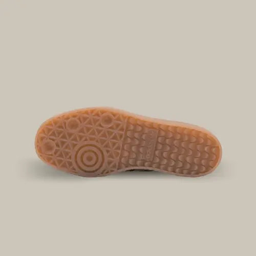La semelle en gomme de caoutchouc de couleur marron.