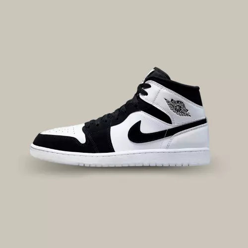 La Air Jordan 1 Mid Diamond Shorts de coté avec sa base en cuir blanc et ses empiècements en daim noir.