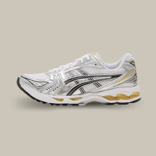 La Asics Gel-Kayano 14 Tai Chi Yellow vue de côté avec sa base en mesh blanc, ses empiècements argentés, son tiger noir et son système d'amorti GEL de couleur jaune.