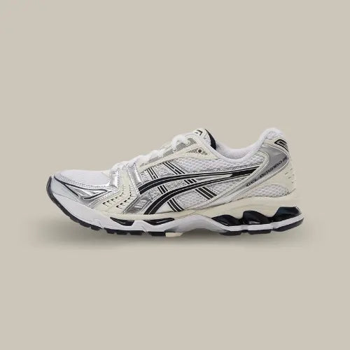 La Asics Gel-Kayano 14 White Midnight vue de côté avec sa base blanche, son tiger bleu marine assorties à la midsole.