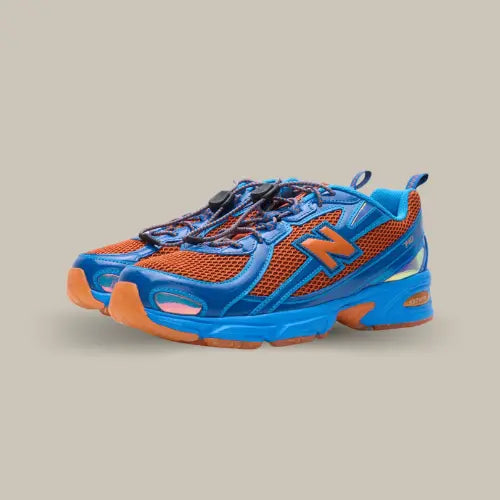 New Balance 740v2 Aminé Benson Tech – Sneakers bleu électrique et orange vif avec système de laçage rapide, semelle ABZORB et design sportif premium, édition collaboration. Disponible sur Offsneakz.
