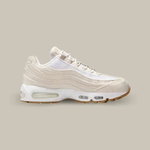 Levis Light Orewood Brown vue de côté avec sa base en denim blanc sous forme de vague et le système Air Max composé de bulles dans la semelle.