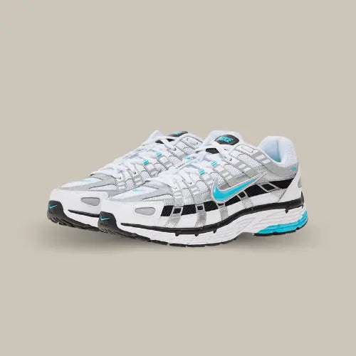 La Nike P-6000 Dusty Cactus est un must-have pour tous ceux qui aiment mélanger style rétro et modernité. Avec son design inspiré des chaussures de running des années 2000, ce modèle allie performance et look audacieux. Le swoosh bleu turquoise se détache parfaitement sur une base blanche et argentée, offrant un contraste visuel percutant. Les superpositions en mesh et cuir assurent une respirabilité optimale, tandis que la semelle intermédiaire amortissante garantit un confort tout au long de la journée. 